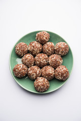 Aliv Laddu, Halim Ladoo or Garden cress Seed sweet Balls a very nutritious food in winters or for New Moms. popular food from India. served in a bowl or plate