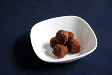 chocolate truffles with cocoa on a restaurant table
