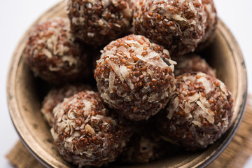 Aliv Laddu, Halim Ladoo or Garden cress Seed sweet Balls a very nutritious food in winters or for New Moms. popular food from India. served in a bowl or plate