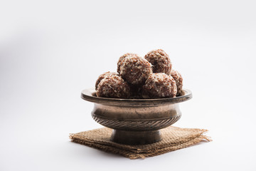 Aliv Laddu, Halim Ladoo or Garden cress Seed sweet Balls a very nutritious food in winters or for New Moms. popular food from India. served in a bowl or plate