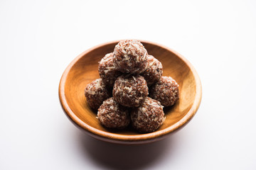 Aliv Laddu, Halim Ladoo or Garden cress Seed sweet Balls a very nutritious food in winters or for New Moms. popular food from India. served in a bowl or plate