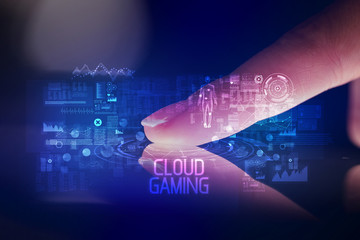 Finger touching tablet with web technology icons and CLOUD GAMING inscription