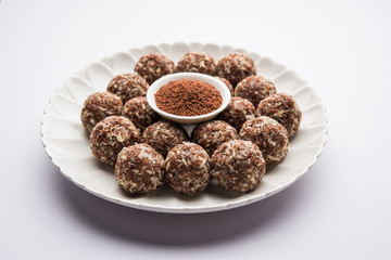 Aliv Laddu, Halim Ladoo or Garden cress Seed sweet Balls a very nutritious food in winters or for New Moms. popular food from India. served in a bowl or plate