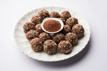 Aliv Laddu, Halim Ladoo or Garden cress Seed sweet Balls a very nutritious food in winters or for New Moms. popular food from India. served in a bowl or plate