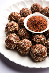 Aliv Laddu, Halim Ladoo or Garden cress Seed sweet Balls a very nutritious food in winters or for New Moms. popular food from India. served in a bowl or plate