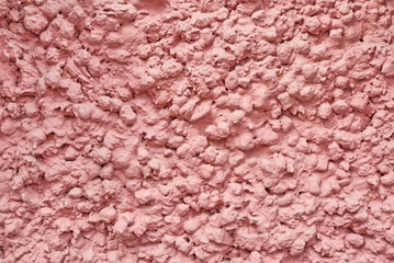 Pink abstract background. Wall with a decorative plaster texture