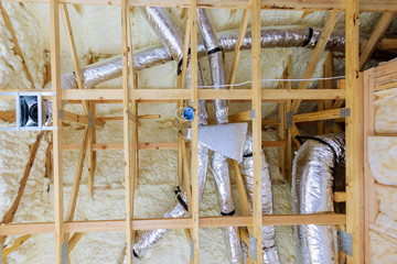 Termal foam plastic insulation new home attic installation of heating system on the roof