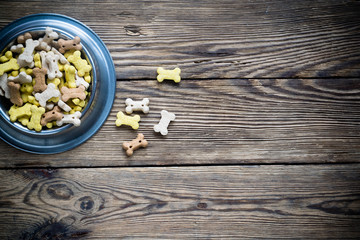 Obraz na płótnie Canvas Dog food in bowl on wooden table