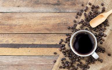 hot coffee and bean on wooden background. top view