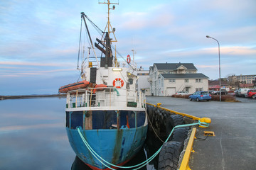 Naklejka premium Old cargo boat at quay in Brønnøysund harbor, Nordland