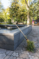 Cleaner broom left in the Kutaisi park in the old part of Kutaisi in Georgia