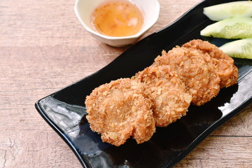 deep fried mashed shrimp with breadcrumbs Thai pancake on plate dipping with sweet sauce