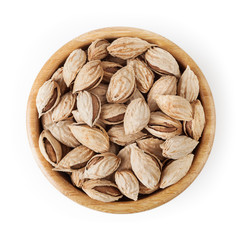 Almonds in wooden bowl isolated on white background with clipping path