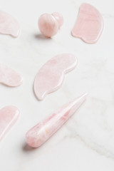 Different kind of pink quartz facial massager