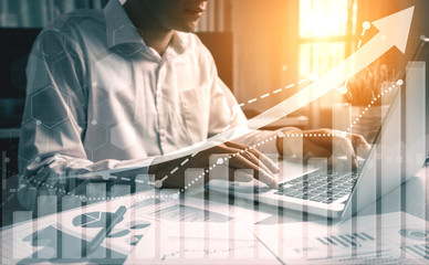 Double Exposure Image of Business and Finance - Businessman with report chart up forward to...