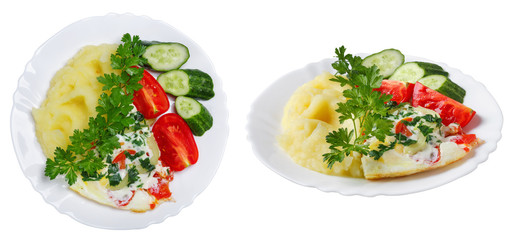 Hot tasty mashed potatoes with scrambled eggs, tomatoes, cucumbers and fresh parsley in  plate.