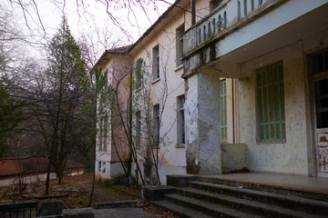 abandoned hotel front  while snowing
