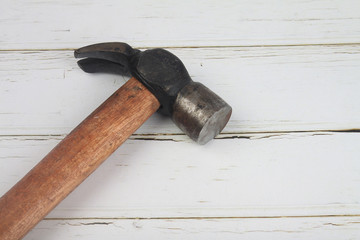 Indian made iron hammer isolated wooden table