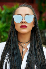 Woman in sunglasses - close up portrait