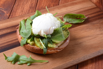 Traditional Spanish andalusian tomato cream soup Salmorejo served with egg, ham jamon, bread in woooden bowl. Summer cold soup concept