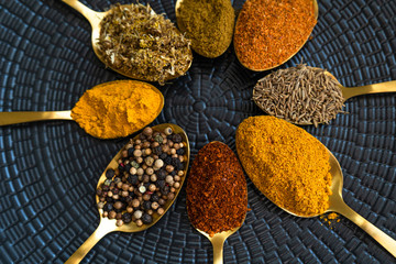 Colourful various herbs and spices for cooking on  background