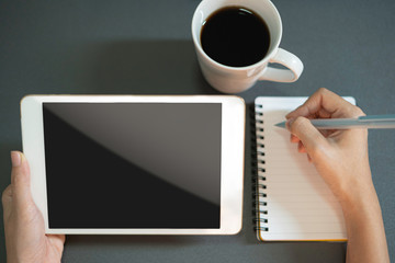 Close up business women working with tablet