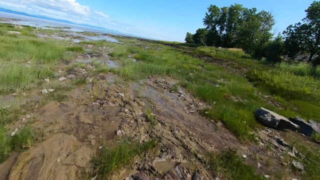 Aerial view drom a drone off a sunset next to St-Lawrence river in Quebec Canada