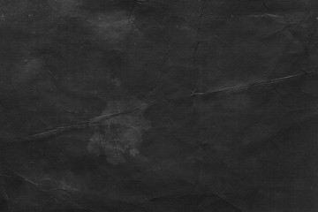 Naklejka premium Cardboard black abstract texture close-up. Dark old paper background. Grunge concrete wall. Vintage blank wallpaper.