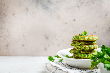 Green broccoli and pea pancakes, copy space. Healthy vegan food concept.