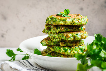 Green broccoli and pea pancakes. Healthy vegan food concept.