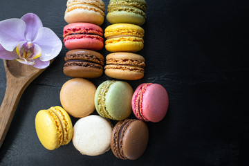 Sweet and colourful french macaroons or macaron on background, Dessert.