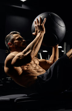 Man Building Core Muscles With Ball.