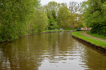 Fototapeta na wymiar Scenic canal view with mooring narrowboats on the Llangollen Canal near Whitchurch, Shropshire, UK
