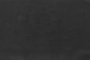 Cardboard black abstract texture close-up. Dark old paper background. Grunge concrete wall. Vintage blank wallpaper.