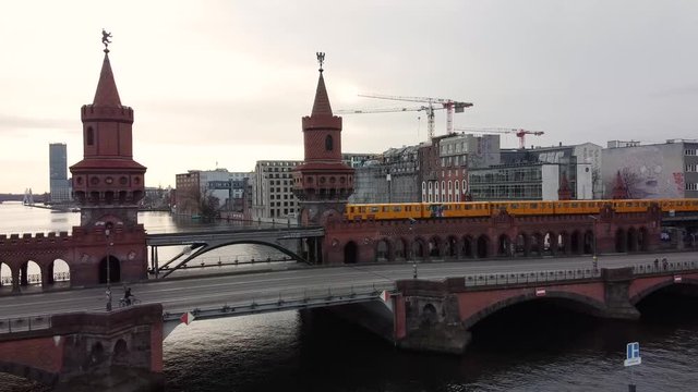Germany, Berlin, December 2019 - aerial footage of the Cityscape of Berlin through Oberbaum Bridge, River Spree