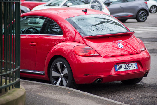 eM- France - 19 January 2020 - Rear view of red new beetle Parked in the street