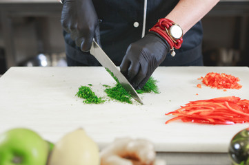 cook preparing dinner in a restaurant kitchen.