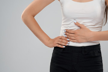 Woman suffering from pain in liver.