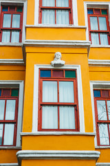 Close-up of an old orange building in the Balat district of Istanbul in Turkey. The houses in this area were built in the 15-18 centuries, not later.