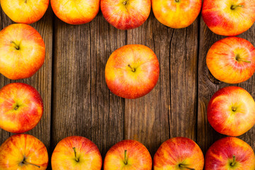 apple fruits frame background, old weathered wood table