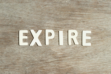 Alphabet letter in word expire on wood background