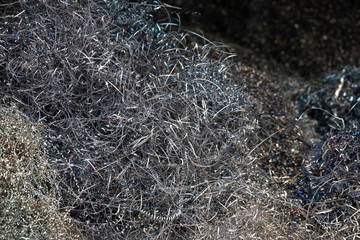 Metal Shavings from CNC machine. waste steel scrap background and texture.