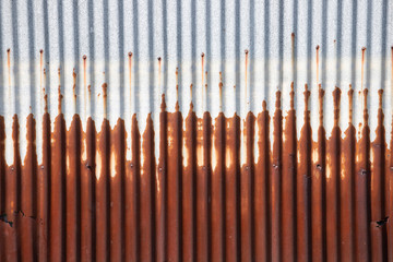 rusty zinc wall background and texture. corrosion from flooding.