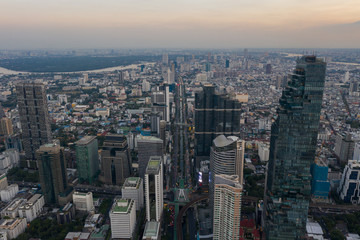 Obraz premium beautiful city view at twilight scene City scape of MahaNakhon building, skyscraper in the Silom/Sathon central business district of Bangkok as the tallest building in Thailand