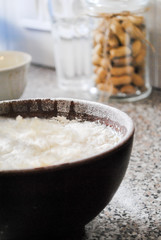 Cooking, dough, flour in a bowl on the kitchen table.
