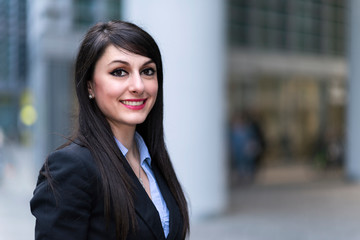 Fototapeta premium Portrait of a young smiling business woman