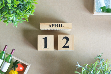 April 12, Empty Background, Design with number cube strawberry pine apple and wine in natural concept.