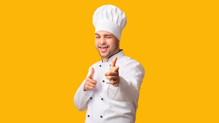 Chef Man Pointing Fingers Winking At Camera Standing, Studio, Panorama