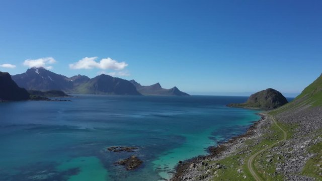 aerial view. flight over the sea,view on the Flakstadoya from Haukland beach and Mannen peak.Lofoten Islands,Norway