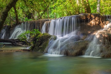 Fototapeta premium The beautiful waterfall in deep forest during rainy season at Phu Hin Rong Kla National Park, Thailand